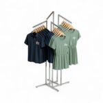 Chrome clothes rail display stand with 4 sloping arms, each with ball-stops – adjustable height garment display for retail.