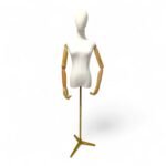 Articulated armed female tailors dummy with gold stand and wooden arms