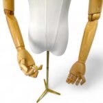 Articulated armed female tailors dummy with gold stand and wooden arms